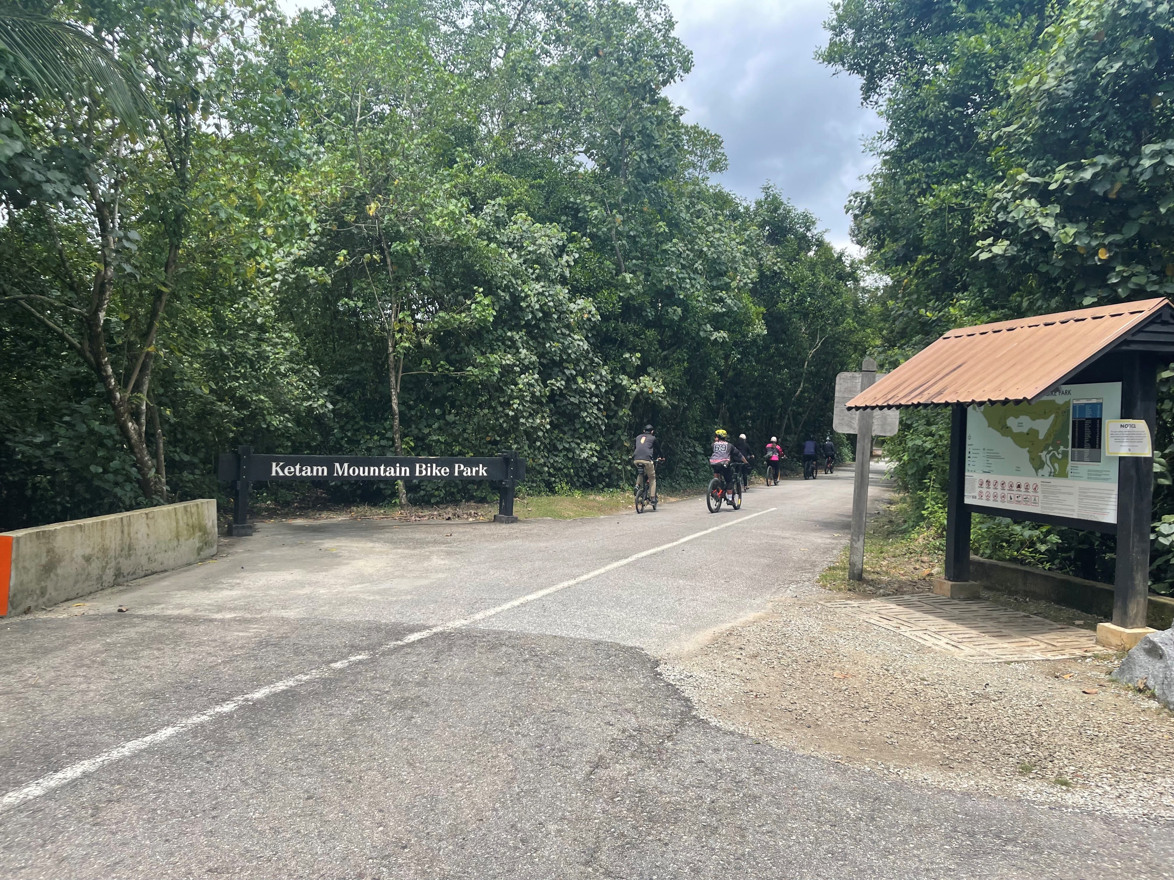 Photo of mountain bikers on a road in the jungle